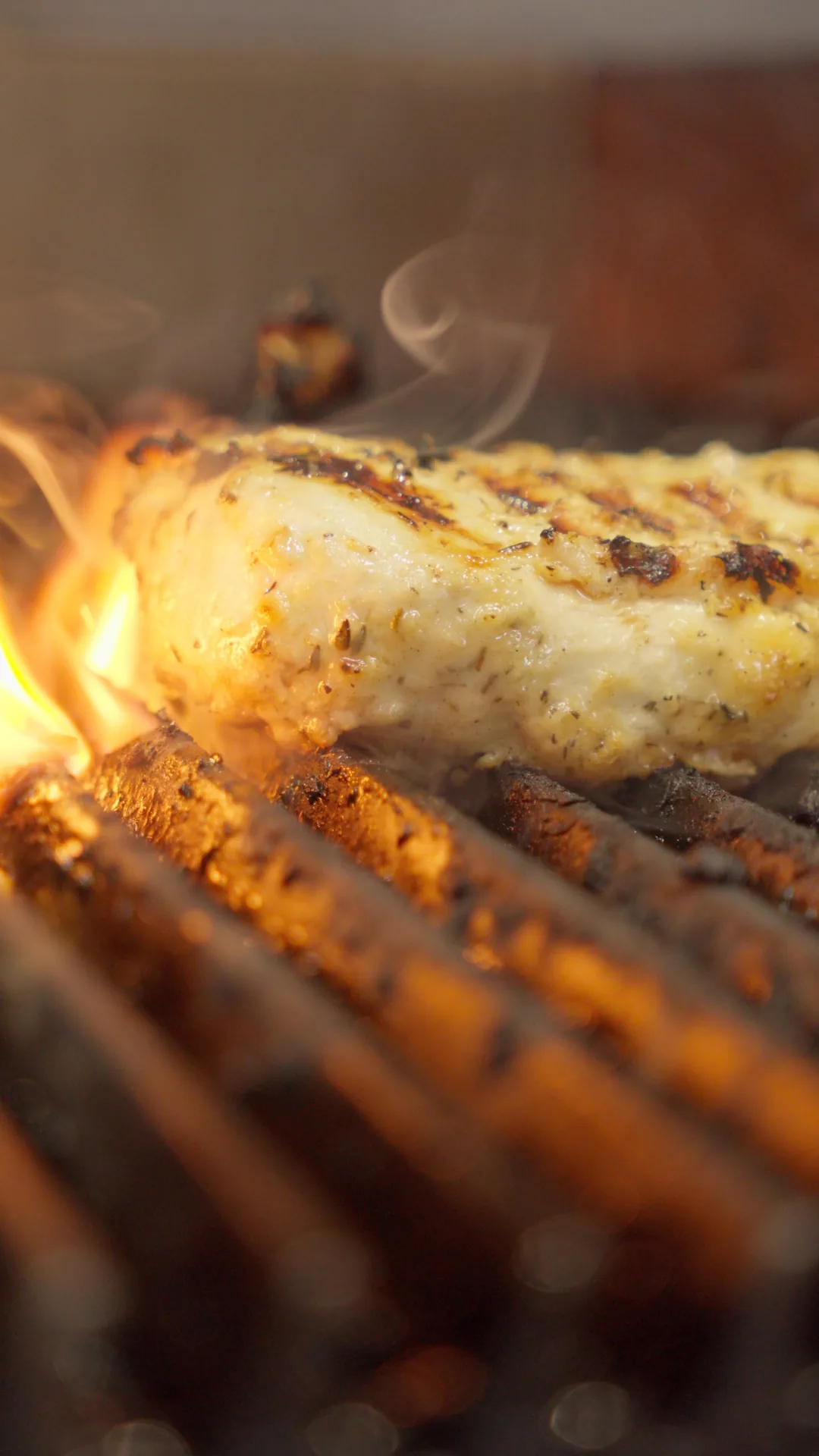 Chicken on grill — flame shot